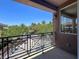 Balcony with iron railing offering views of the neighborhood at 9116 Vista Greens Way # 104, Las Vegas, NV 89134