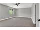 Spacious bedroom with carpeted floors, ceiling fan, and natural light at 9116 Vista Greens Way # 104, Las Vegas, NV 89134