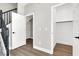 Entryway featuring a staircase and closet with light gray walls and light wood-look floors at 9116 Vista Greens Way # 104, Las Vegas, NV 89134