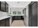 Modern kitchen features stainless steel appliances, granite countertops, and light wood floors at 9116 Vista Greens Way # 104, Las Vegas, NV 89134