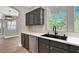 Kitchen features stainless steel appliances, stone countertops, recessed lighting, and hardwood floors at 9116 Vista Greens Way # 104, Las Vegas, NV 89134