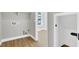 Utility room with a window and hook-ups, with views to a bedroom space at 9116 Vista Greens Way # 104, Las Vegas, NV 89134