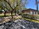 Guest parking area beside community mailboxes, surrounded by mature trees, manicured landscaping and clear skies at 9116 Vista Greens Way # 104, Las Vegas, NV 89134