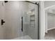 Modern glass shower with a built-in niche and black hardware at 9116 Vista Greens Way # 104, Las Vegas, NV 89134
