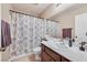 A compact bathroom with a single sink and decorative shower curtain at 9118 Mount Wilson St, Las Vegas, NV 89113