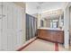 Well-lit bathroom with double sinks, shower, and neutral tones at 9118 Mount Wilson St, Las Vegas, NV 89113