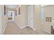 Well-lit hallway with carpet floors and neutral colored walls at 9118 Mount Wilson St, Las Vegas, NV 89113