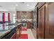 Well-appointed kitchen with dark cabinetry, stainless steel appliances, and granite countertops at 9118 Mount Wilson St, Las Vegas, NV 89113