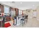 Modern kitchen featuring a breakfast bar, stainless steel appliances, and bright, airy lighting at 9118 Mount Wilson St, Las Vegas, NV 89113