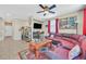 Open-concept living room with tile flooring, a ceiling fan, and a view into other rooms at 9118 Mount Wilson St, Las Vegas, NV 89113