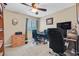 Carpeted office featuring a ceiling fan, natural light, and a workstation at 9118 Mount Wilson St, Las Vegas, NV 89113