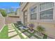 Back patio features a paver and artificial turf grid pattern, stucco walls, and a glass door at 9118 Mount Wilson St, Las Vegas, NV 89113