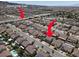 Aerial view of neighborhood including street names, nearby mountains, and houses at 93 Autumn Day St, Henderson, NV 89012