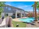 Beautiful backyard showcasing a refreshing pool, manicured landscaping, and outdoor patio at 93 Autumn Day St, Henderson, NV 89012