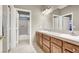Bright bathroom with double sinks and a separate room for the shower and toilet, offering convenience at 93 Autumn Day St, Henderson, NV 89012