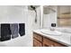 Bathroom featuring a modern vanity, tiled walls, and a glass-enclosed shower at 93 Autumn Day St, Henderson, NV 89012