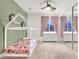 Stylish bedroom with a decorative bed frame, mirrored closet doors, and soft color accents at 93 Autumn Day St, Henderson, NV 89012