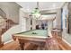Billiard room featuring a classic pool table, hardwood floors, and natural light at 93 Autumn Day St, Henderson, NV 89012