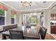 Open-concept dining room offering seamless flow to the living spaces with hardwood floors at 93 Autumn Day St, Henderson, NV 89012