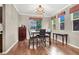 Dining room featuring wood floors, a chandelier, and lots of natural light at 93 Autumn Day St, Henderson, NV 89012