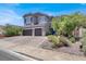 Charming two-story home with a three-car garage, neutral paint, and beautifully landscaped yard at 93 Autumn Day St, Henderson, NV 89012