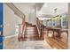 Elegant foyer showcasing a staircase and open view to the dining and billiard rooms at 93 Autumn Day St, Henderson, NV 89012