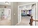 Hallway view into two bedrooms, showing a light and airy space with ample natural light at 93 Autumn Day St, Henderson, NV 89012