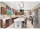 Gourmet kitchen with stainless steel appliances and a center island with bar seating at 93 Autumn Day St, Henderson, NV 89012