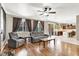 Spacious living room showcasing hardwood floors, large windows, and comfortable seating at 93 Autumn Day St, Henderson, NV 89012