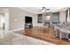 Inviting living room with hardwood flooring, fireplace, and large-screen television at 93 Autumn Day St, Henderson, NV 89012