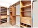 Spacious walk-in closet with custom shelving, drawers, and hanging rods for organized storage solutions at 93 Autumn Day St, Henderson, NV 89012