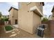View of the exterior backyard space featuring gravel landscaping and compact air conditioning units at 9312 Poseidon Valley Ave, Las Vegas, NV 89178
