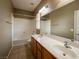 Bright bathroom featuring a double sink vanity and a shower-over-tub combination at 9312 Poseidon Valley Ave, Las Vegas, NV 89178