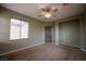 Bedroom featuring neutral walls, plush carpeting, and an open doorway at 9312 Poseidon Valley Ave, Las Vegas, NV 89178
