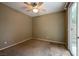 Carpeted bedroom with ceiling fan and sliding door to backyard at 9312 Poseidon Valley Ave, Las Vegas, NV 89178
