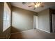 Bedroom featuring neutral walls, carpet floors, and large window at 9312 Poseidon Valley Ave, Las Vegas, NV 89178