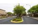 Street view of a landscaped community entrance with a decorative wrought iron gate at 9312 Poseidon Valley Ave, Las Vegas, NV 89178