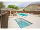 An inviting community pool area featuring ample lounge seating and shaded seating at 9312 Poseidon Valley Ave, Las Vegas, NV 89178