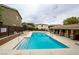 Community pool area featuring lounge chairs and shaded seating at 9312 Poseidon Valley Ave, Las Vegas, NV 89178