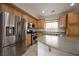 Kitchen view highlighting the stainless steel refrigerator and ample counter space at 9312 Poseidon Valley Ave, Las Vegas, NV 89178