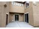 Outdoor patio featuring sliding glass doors, stucco walls, and concrete flooring at 9312 Poseidon Valley Ave, Las Vegas, NV 89178