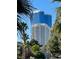 Stunning view of modern buildings with palm trees in the foreground, set against a clear blue sky at 940 Vegas Valley Dr, Las Vegas, NV 89109