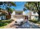 Charming two-story home with a well-manicured front yard and a two-car garage, complete with a luxury car at 940 Vegas Valley Dr, Las Vegas, NV 89109