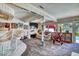 Large living room with a wet bar, ample seating, and views of the backyard pool at 940 Vegas Valley Dr, Las Vegas, NV 89109