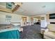 Spacious main bedroom with gray carpet, mirrored closet doors, and access to the en-suite bathroom at 940 Vegas Valley Dr, Las Vegas, NV 89109