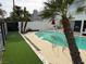 Private backyard oasis featuring a refreshing in-ground pool and tropical landscaping at 940 Vegas Valley Dr, Las Vegas, NV 89109