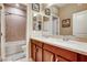 Bathroom features a double sink vanity, framed mirrors, and separate bathtub-shower area at 9537 Wild Valley Ave, Las Vegas, NV 89148