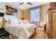 Comfortable bedroom with ceiling fan, plush bed, and stylish decor for a relaxing atmosphere at 9537 Wild Valley Ave, Las Vegas, NV 89148