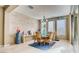 Elegant dining room with natural light, stylish chandelier, and modern decor at 9537 Wild Valley Ave, Las Vegas, NV 89148