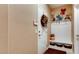 Welcoming entryway with convenient coat rack, storage bench, and decorative wreath on the door at 9537 Wild Valley Ave, Las Vegas, NV 89148